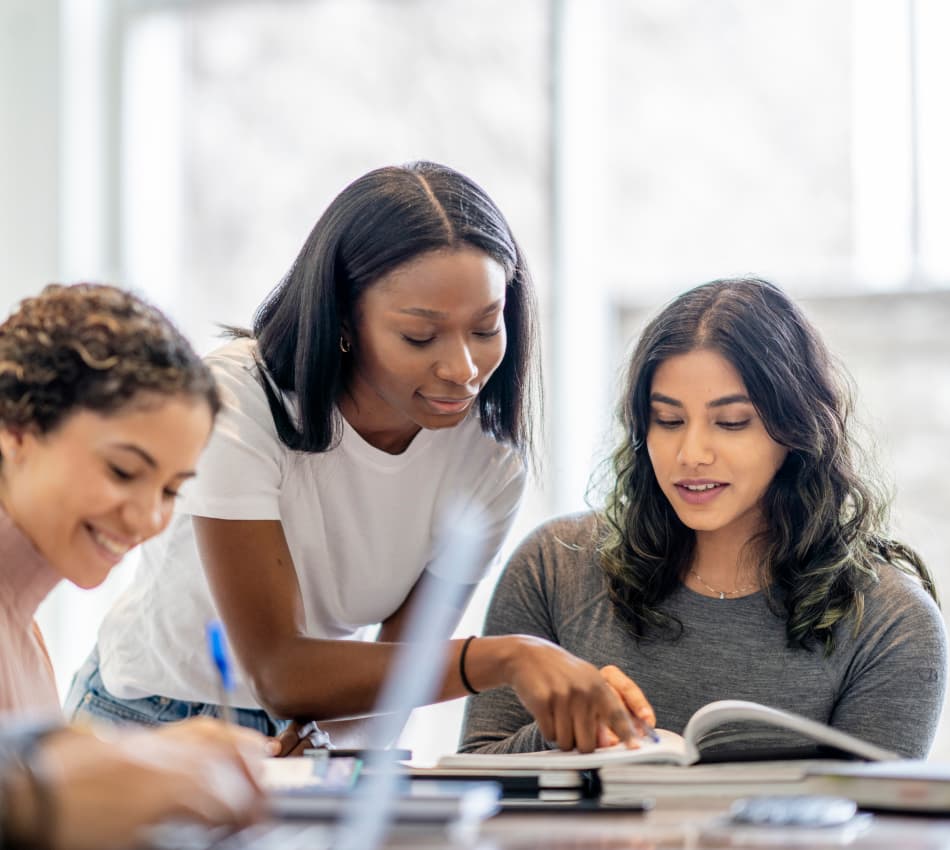 A team of professionals improves their financial literacy by reading through a book together.